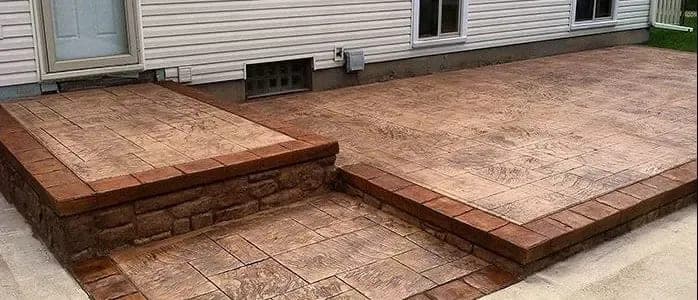 Ashlar slate stamped concrete patio and steps with a semi-gloss sealer