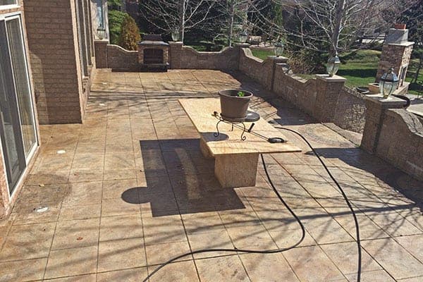 Stamped concrete courtyard patio in Woodstock before sealing
